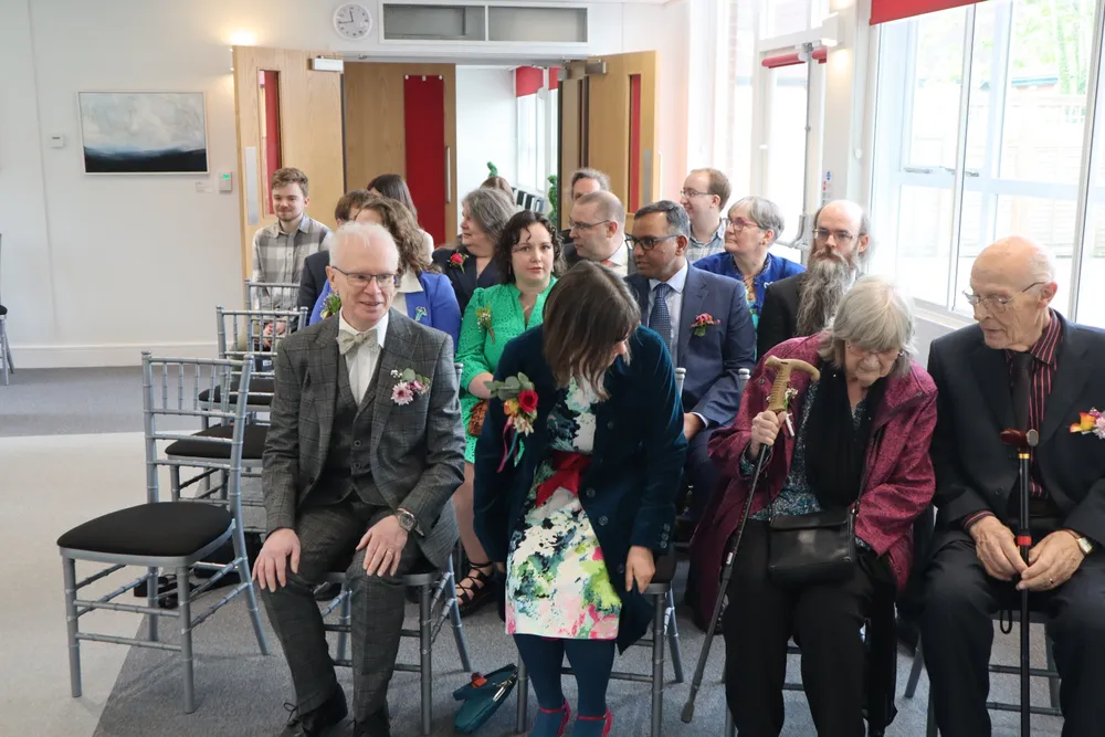 People taking their seats as they arrived in the room