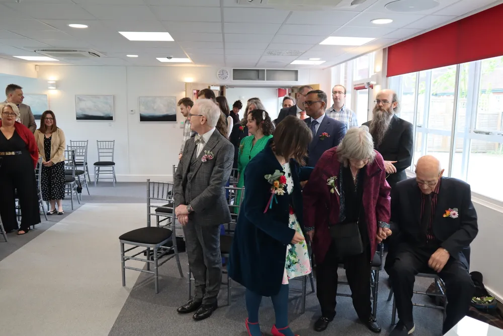 ...and almost immediately standing up for us to make our entrance