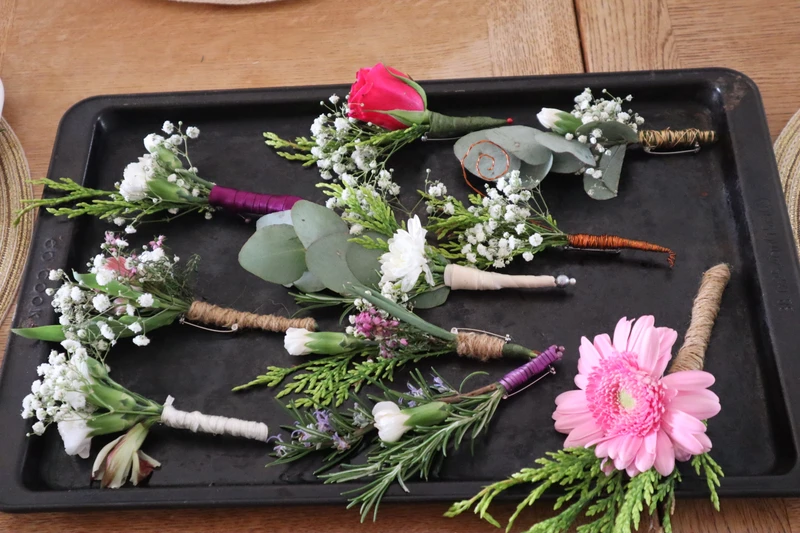All the flowers to be attached to brooch bars